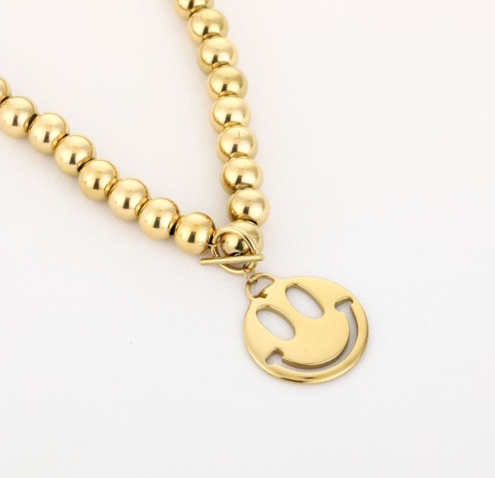 Ketting bal smiley goud